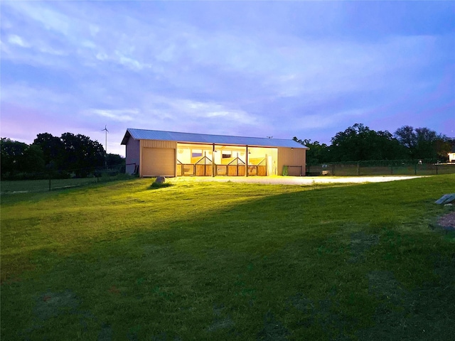 1299 Harmony Cir, Weatherford, TX 76087 - back of property at dusk with a garage and dirt driveway