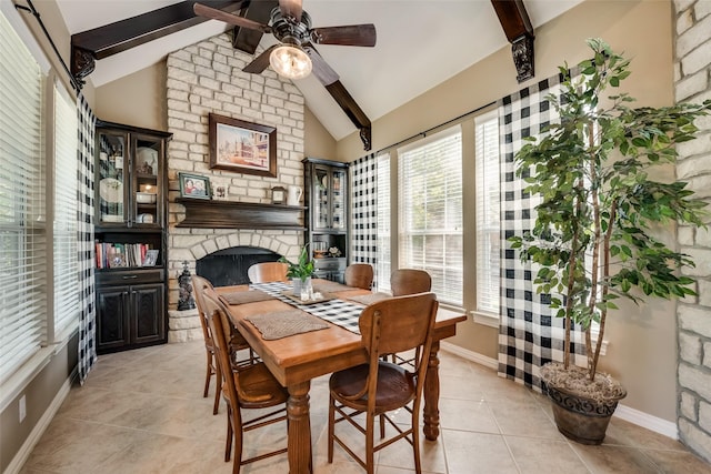 3325 Creek Rd, Keller, TX 76248 - dining area with light tile patterned floors, ceiling fan, baseboards, and a stone fireplace