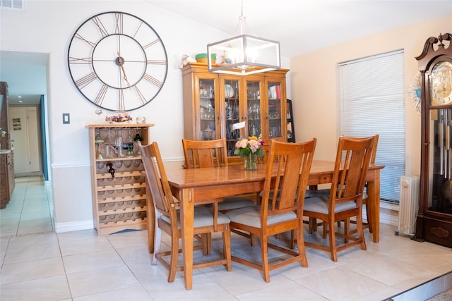 7016 Buttonwood Dr, Fort Worth, TX 76137 - dining area featuring radiator heating unit, light tile patterned floors, baseboards, and a chandelier