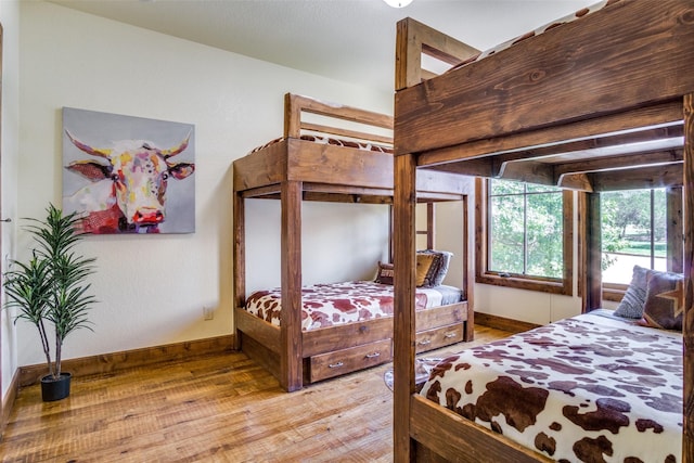1633 Scenic Dr Unit 201, Graford, TX 76449 - bedroom featuring wood finished floors and baseboards