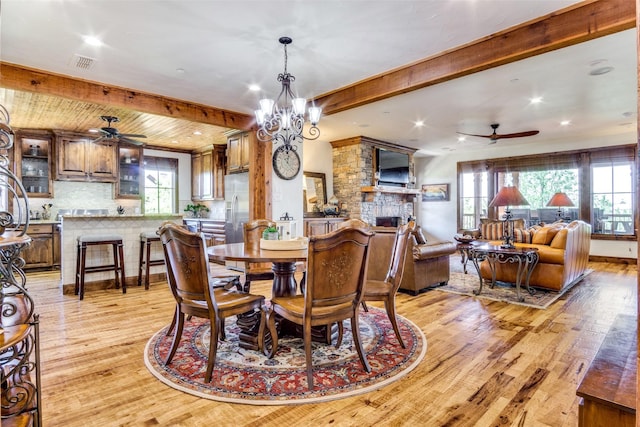 1633 Scenic Dr Unit 201, Graford, TX 76449 - dining area featuring a ceiling fan, light wood-style floors, a fireplace, beam ceiling, and recessed lighting