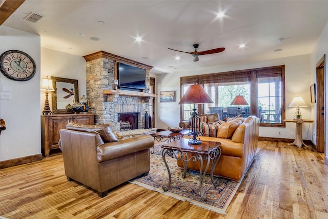 1633 Scenic Dr Unit 201, Graford, TX 76449 - living area with light wood-style floors, baseboards, a fireplace, and a ceiling fan