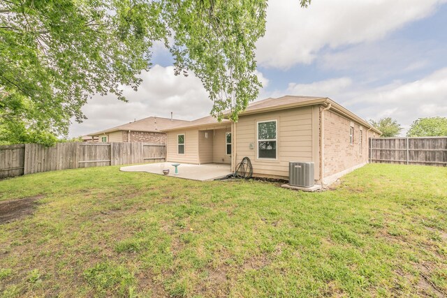 3001 Rocking Hills Trl, Forney, TX 75126 - back of property featuring a patio, central AC, and brick siding