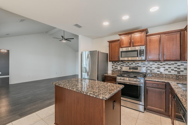 3001 Rocking Hills Trl, Forney, TX 75126 - kitchen with stainless steel appliances, light tile patterned floors, decorative backsplash, dark stone counters, and recessed lighting