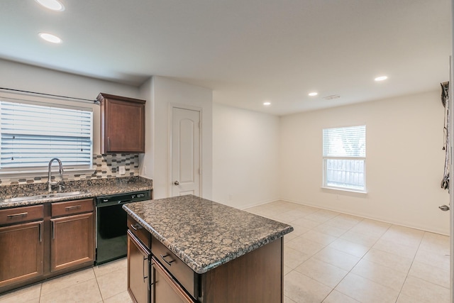 3001 Rocking Hills Trl, Forney, TX 75126 - kitchen with black dishwasher, a sink, recessed lighting, dark brown cabinetry, and a center island