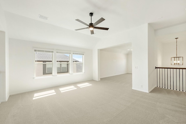 1024 Emerald Trace Dr, Justin, TX 76247 - unfurnished room with light carpet, ceiling fan, a chandelier, vaulted ceiling, and baseboards