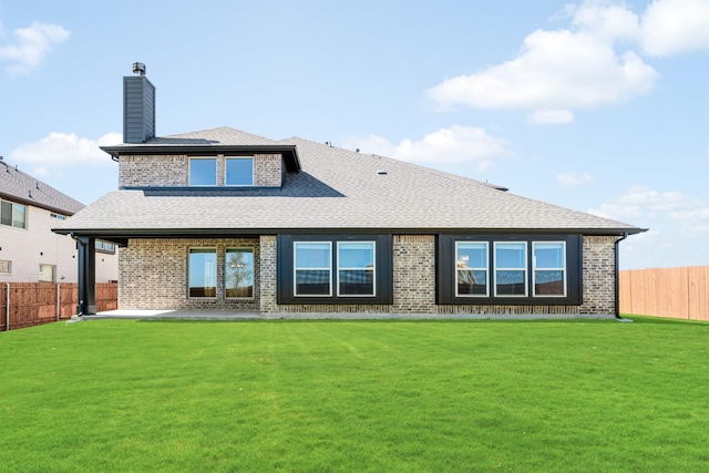 1024 Emerald Trace Dr, Justin, TX 76247 - back of property featuring brick siding, roof with shingles, a chimney, and a patio