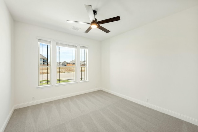 1024 Emerald Trace Dr, Justin, TX 76247 - empty room with light colored carpet, baseboards, and a ceiling fan