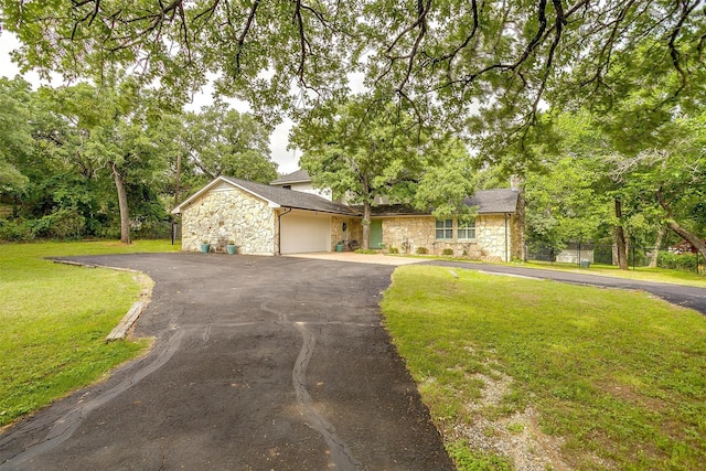 132 S Briaroaks Rd, Burleson, TX 76028 - view of front of house with stone siding, driveway, an attached garage, and a front lawn