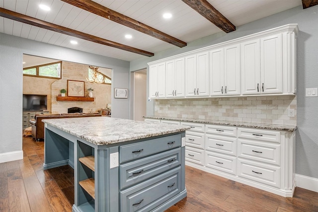 132 S Briaroaks Rd, Burleson, TX 76028 - kitchen featuring gray cabinets, white cabinetry, beamed ceiling, open shelves, and a center island