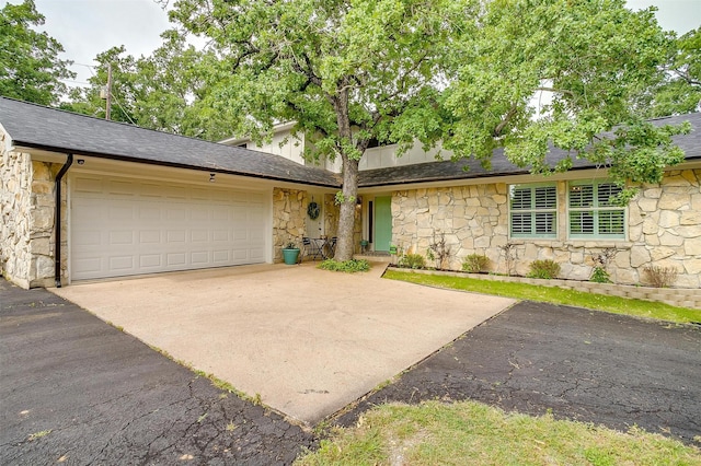 132 S Briaroaks Rd, Burleson, TX 76028 - view of front of property featuring stone siding, driveway, a garage, and a shingled roof