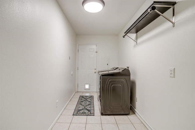 132 S Briaroaks Rd, Burleson, TX 76028 - laundry room featuring light tile patterned floors, baseboards, and washer / clothes dryer