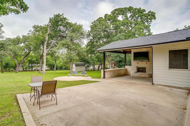 132 S Briaroaks Rd, Burleson, TX 76028 - view of patio / terrace with an outdoor stone fireplace, a storage shed, an outdoor structure, and view of wooded area