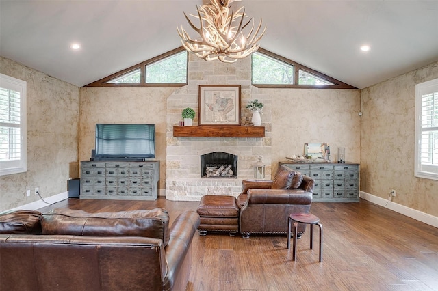 132 S Briaroaks Rd, Burleson, TX 76028 - living room featuring a chandelier, wood finished floors, vaulted ceiling, a fireplace, and baseboards