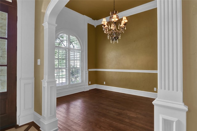 6805 Castle Pines Ct, Tyler, TX 75703 - foyer featuring wood finished floors, arched walkways, a chandelier, and baseboards