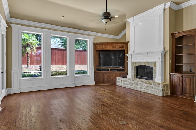 6805 Castle Pines Ct, Tyler, TX 75703 - unfurnished living room featuring a fireplace, dark wood-type flooring, a ceiling fan, healthy amount of natural light, and ornamental molding