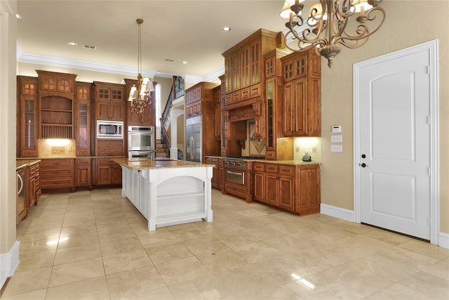 6805 Castle Pines Ct, Tyler, TX 75703 - kitchen featuring a chandelier, built in appliances, brown cabinets, tasteful backsplash, and crown molding
