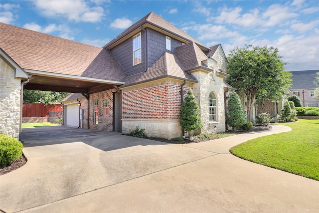6805 Castle Pines Ct, Tyler, TX 75703 - view of front of property with stone siding, driveway, roof with shingles, an attached garage, and brick siding