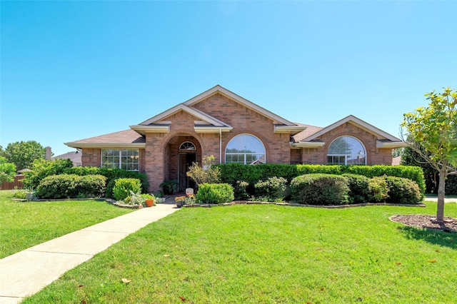 112 Glen Ridge Dr, Murphy, TX 75094 - single story home featuring brick siding and a front yard