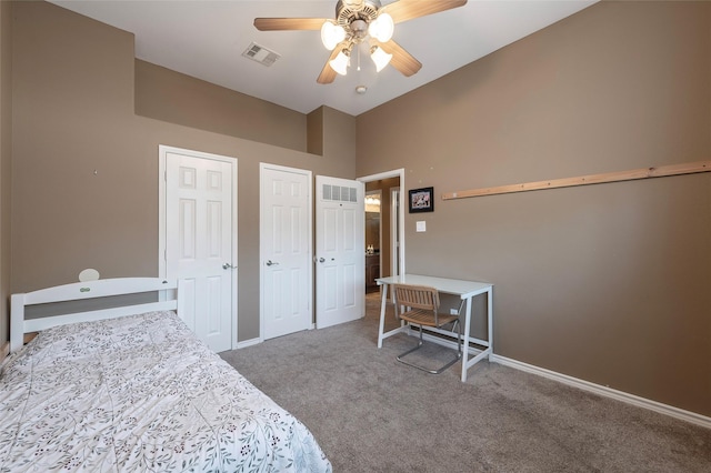 112 Glen Ridge Dr, Murphy, TX 75094 - bedroom featuring carpet floors, multiple closets, baseboards, a ceiling fan, and a towering ceiling