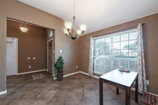 112 Glen Ridge Dr, Murphy, TX 75094 - unfurnished dining area featuring a chandelier, baseboards, and lofted ceiling