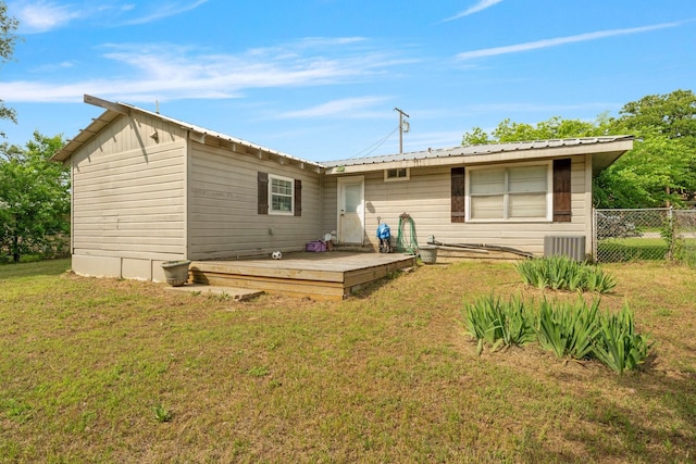 685 S First Ave, Stephenville, TX 76401 - rear view of property with a deck, central AC, and metal roof