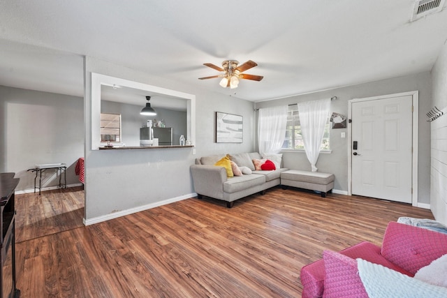 685 S First Ave, Stephenville, TX 76401 - living area with ceiling fan, wood finished floors, and baseboards