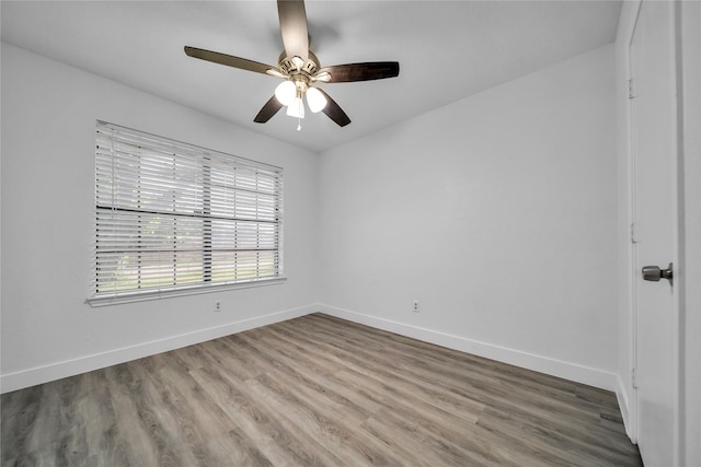 1204 Oak Park Dr, Dallas, TX 75232 - unfurnished room with baseboards, wood finished floors, and ceiling fan