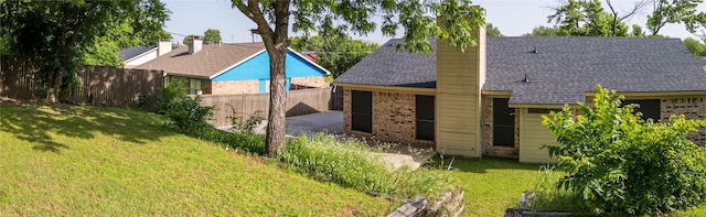 1204 Oak Park Dr, Dallas, TX 75232 - rear view of property featuring brick siding, a chimney, roof with shingles, and a garage