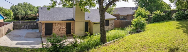 1204 Oak Park Dr, Dallas, TX 75232 - view of front of property with brick siding and a chimney