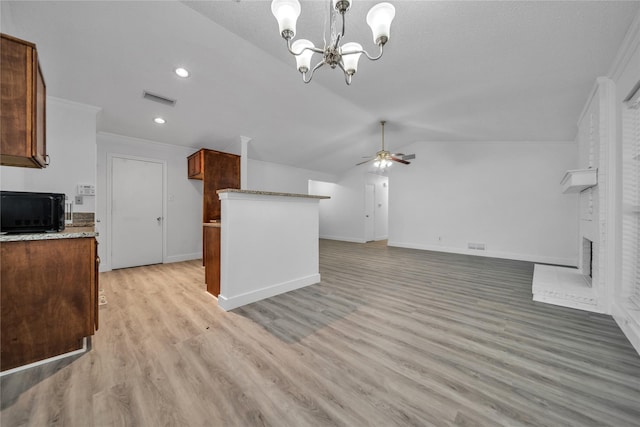 1204 Oak Park Dr, Dallas, TX 75232 - kitchen with vaulted ceiling, ceiling fan, a chandelier, baseboards, and black microwave