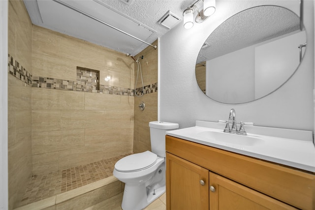 1204 Oak Park Dr, Dallas, TX 75232 - full bath featuring toilet, a tile shower, vanity, and a textured ceiling
