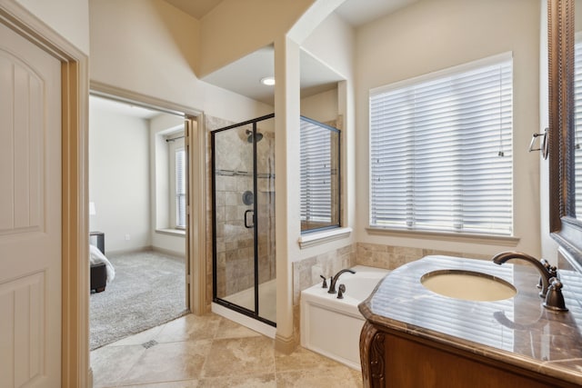 689 Barringer Ct, Fate, TX 75087 - bathroom featuring a sink, a shower stall, a garden tub, and tile patterned flooring