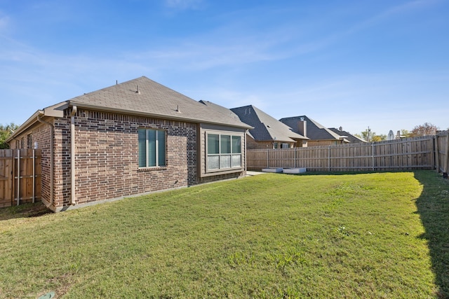 689 Barringer Ct, Fate, TX 75087 - back of property with brick siding and roof with shingles