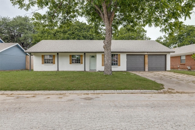 324 Deer Creek Rd, Everman, TX 76140 - single story home with concrete driveway, a garage, a front lawn, brick siding, and a shingled roof