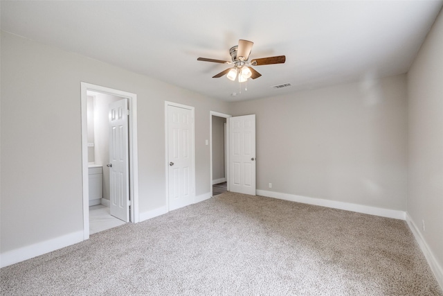 324 Deer Creek Rd, Everman, TX 76140 - unfurnished bedroom featuring carpet, ensuite bathroom, and baseboards