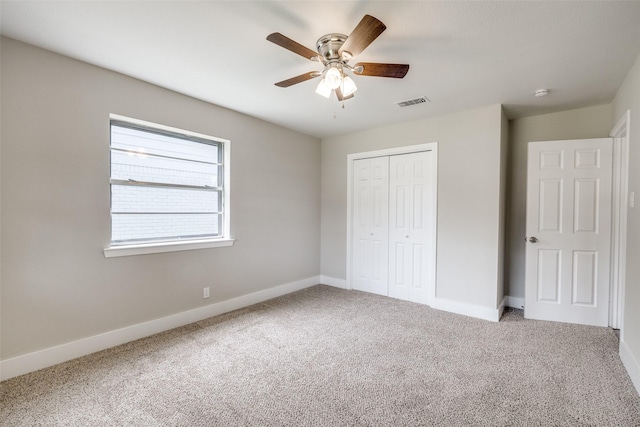 324 Deer Creek Rd, Everman, TX 76140 - unfurnished bedroom featuring carpet, a closet, baseboards, and ceiling fan