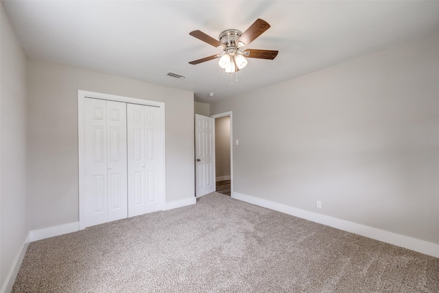 324 Deer Creek Rd, Everman, TX 76140 - unfurnished bedroom featuring carpet, a closet, baseboards, and a ceiling fan