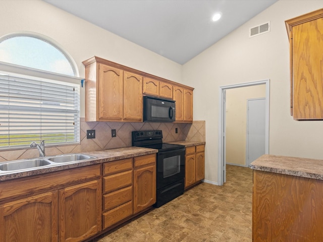 7404 Sunray Dr, Fort Worth, TX 76120 - kitchen featuring black appliances, a sink, vaulted ceiling, backsplash, and brown cabinets