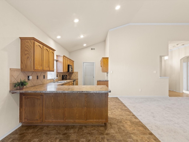 7404 Sunray Dr, Fort Worth, TX 76120 - kitchen featuring a sink, vaulted ceiling, black microwave, arched walkways, and recessed lighting