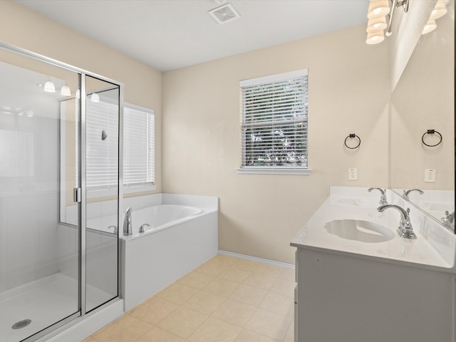 7404 Sunray Dr, Fort Worth, TX 76120 - full bath with a bath, a shower stall, double vanity, and baseboards