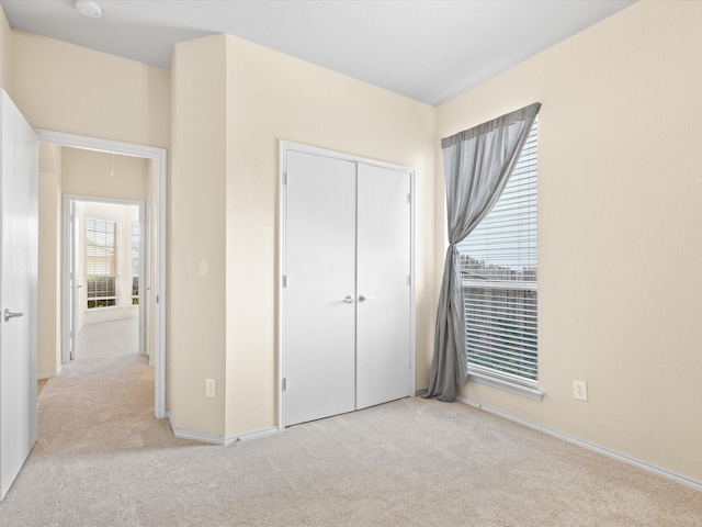 7404 Sunray Dr, Fort Worth, TX 76120 - unfurnished bedroom featuring carpet flooring, a closet, and baseboards