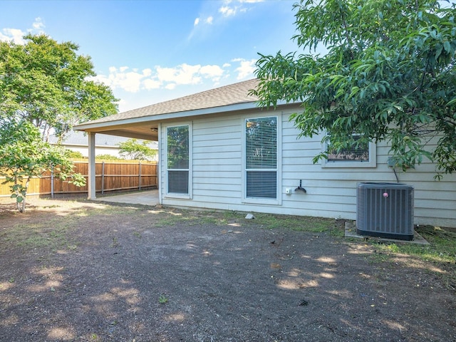 7404 Sunray Dr, Fort Worth, TX 76120 - rear view of property with fence and cooling unit
