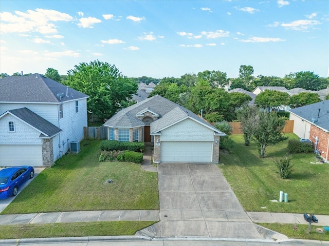 7404 Sunray Dr, Fort Worth, TX 76120 - view of front facade with central AC, driveway, an attached garage, and brick siding