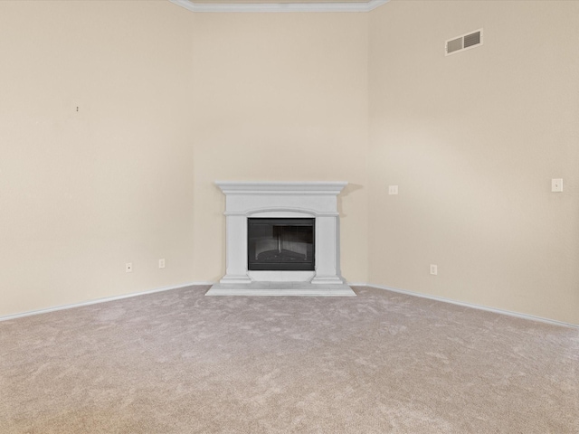7404 Sunray Dr, Fort Worth, TX 76120 - unfurnished living room with carpet, crown molding, a glass covered fireplace, and baseboards