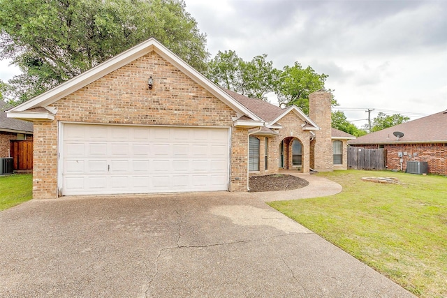 3941 Devonaire Dr, Fort Worth, TX 76008 - view of front of home featuring concrete driveway, brick siding, cooling unit, and a chimney
