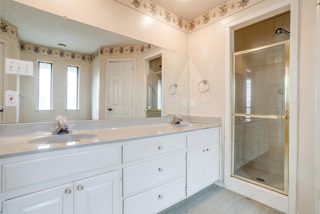3941 Devonaire Dr, Fort Worth, TX 76008 - full bath with a shower stall, double vanity, and a textured ceiling