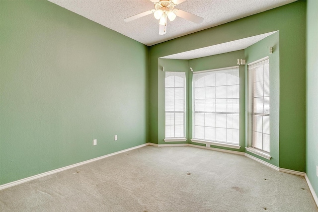 3941 Devonaire Dr, Fort Worth, TX 76008 - carpeted empty room featuring a textured ceiling, baseboards, and ceiling fan