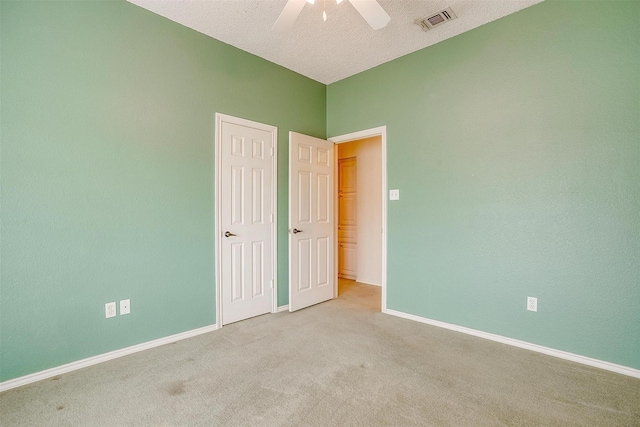 3941 Devonaire Dr, Fort Worth, TX 76008 - unfurnished bedroom with baseboards, carpet, a ceiling fan, and a textured ceiling