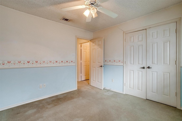 3941 Devonaire Dr, Fort Worth, TX 76008 - unfurnished bedroom with carpet, a closet, a ceiling fan, and a textured ceiling